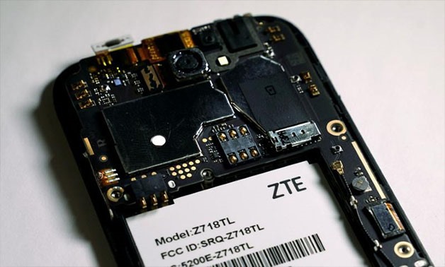 The inside of a ZTE smart phone is pictured in this illustration taken April 17, 2018. REUTERS/Carlo Allegri/Illustration/File Photo