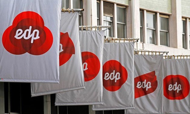 Banners bearing the logo of Energias de Portugal (EDP) are seen at the company headquarters in Lisbon, Portugal, December 13, 2011. REUTERS/Jose Manuel Ribeiro/FILE PHOTO
