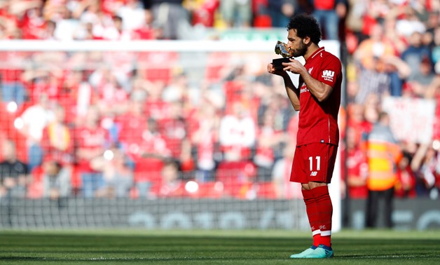 Premier League - Liverpool vs Brighton & Hove Albion - Anfield, Liverpool, Britain - May 13, 2018 Liverpool's Mohamed Salah celebrates with the Golden Boot after the match REUTERS/Phil Noble