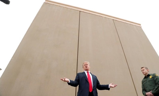U.S. President Donald Trump speaks while participating in a tour of U.S.-Mexico border wall prototypes near the Otay Mesa Port of Entry in San Diego, California. U.S., March 13, 2018. REUTERS/Kevin Lamarque
