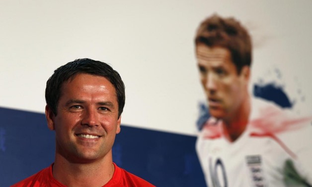 Former England national soccer team player Michael Owen attends a World Cup promotional event at a shopping mall in Hong Kong June 8, 2014. REUTERS/Bobby 