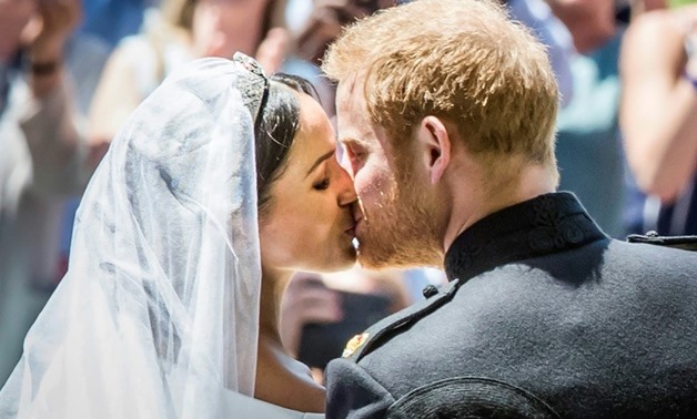 The royal newlyweds kissed in front of the Windsor crowds
