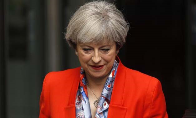 Britain's Prime Minister Theresa May leaves the BBC - Reuters