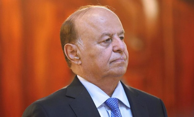 Yemen's President Abdu Rabbu Mansour Hadi stands during a reception ceremony during the holy fasting month of Ramadan at the Republican Palace in Sanaa in this July 7, 2014 file photo. REUTERS/Khaled Abdullah/Files