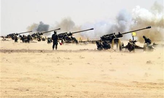 An undated handout photo distributed by the Syrian News Agency (SANA) on July 8, 2012, shows Syrian armed forces during a live ammunitions exercise in an undisclosed location. REUTERS/SANA/Handout