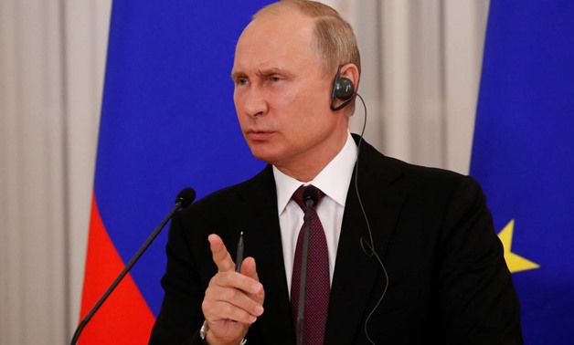 Russian President Vladimir Putin speaks a during a news conference after the talks with his French counterpart Emmanuel Macron in St. Petersburg, Russia May 24, 2018. REUTERS/Grigory Dukor
