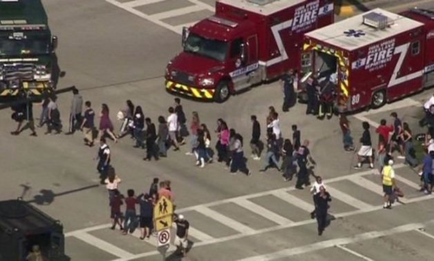 Students are evacuated from Marjory Stoneman Douglas High School during a shooting incident in Parkland, Florida, U.S. February 14, 2018 in a still image from video. | Photo: Reuters