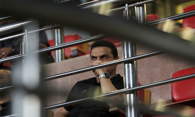Al-Ahly coach Hossam Al-Badry watches the game from the stands after being sent off for a misconduct