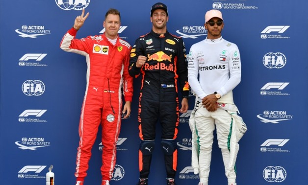 Red Bull's Daniel Ricciardo sporting his trademark smile after securing pole at Monaco in a record time - AFP / Andrej ISAKOVIC
