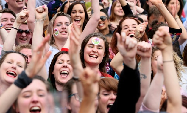 Yes campaigners rejoice ahead of the final result of a landmark referendum in which Ireland voted by 66 percent to ditch its strict abortion laws
