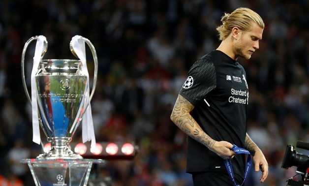 Soccer Football - Champions League Final - Real Madrid v Liverpool - NSC Olympic Stadium, Kiev, Ukraine - May 26, 2018 Liverpool's Loris Karius walks past the trophy with his medal after the match REUTERS/Kai Pfaffenbach
