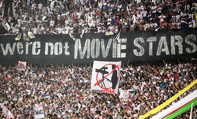 El Zamalek fans display a banner during their Egyptian Cup semi-final soccer match against Haras El Hodood in Cairo Stadium October 1, 2011 (Photo: Reuters)
