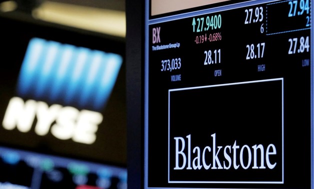 FILE PHOTO: The ticker and trading information for Blackstone Group is displayed at the post where it is traded on the floor of the New York Stock Exchange (NYSE), New York, NY, U.S., April 4, 2016. REUTERS/Brendan McDermid/File Photo