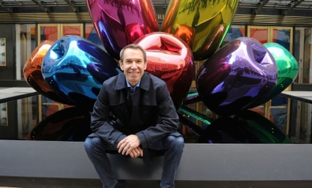 US artist Jeff Koons is pictured in New York in 2012 with one of his previous artwork installations of flowers, called "Tulips" - AFP
