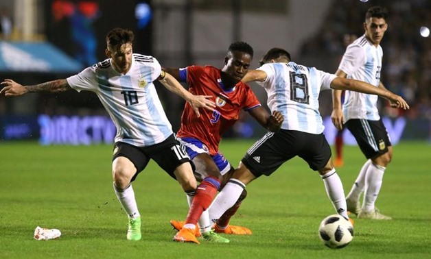 Soccer Football - International Friendly - Argentina vs Haiti - La Bombonera, Buenos Aires, Argentina - May 29, 2018 Argentina's Lionel Messi and Marcos Acuna in action with Haiti's Richelor Sprangers REUTERS/Agustin Marcarian
