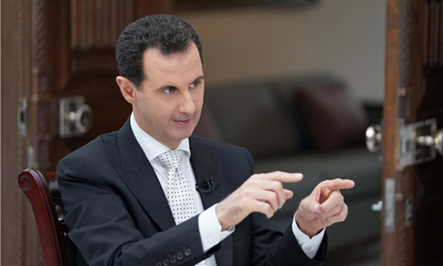 Syria's President Bashar al Assad gestures during an interview with a Greek newspaper in Damascus, Syria in this handout released May 10, 2018. SANA/Handout via Reuters
