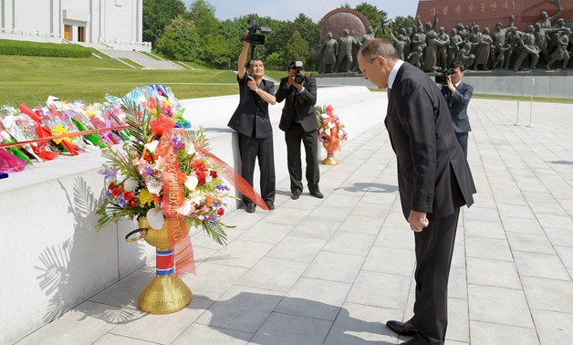 Russian Foreign Minister Sergei Lavrov lays a flower basket before the statues of late North Korean founder Kim Il Sung and late leader Kim Jong Il as he pays tribute, on Mansu Hill in Pyongyang, North Korea in this handout picture released by North Korea