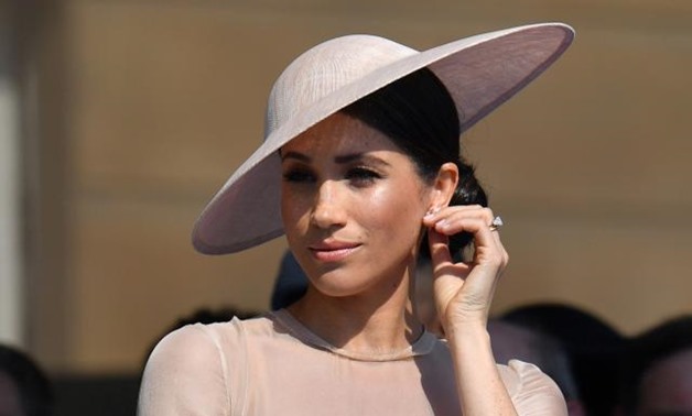Meghan, Duchess of Sussex attends a garden party at Buckingham Palace, in London, Britain May 22, 2018. Dominic Lipinski/Pool via Reuters.