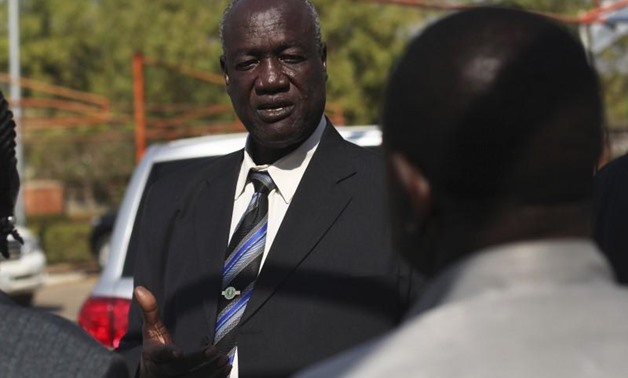 FILE PHOTO - South Sudan's Defence Minister Kuol Manyang Juuk, talks to cabinet members after a cabinet meeting in Juba January 17, 2014. REUTERS/Andreea Campeanu.