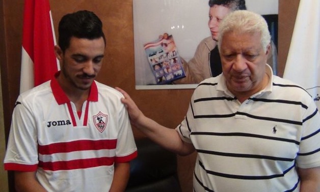 FILE - Ibrahim Hassan wearing Zamaelk shirt standing with Mortada Mansour