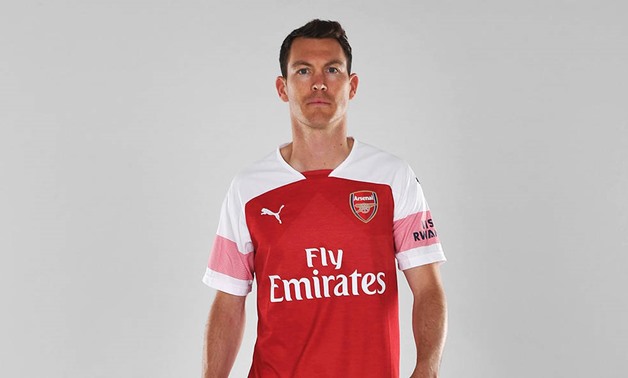 FILE - Lichtsteiner wearing Arsenal shirt 