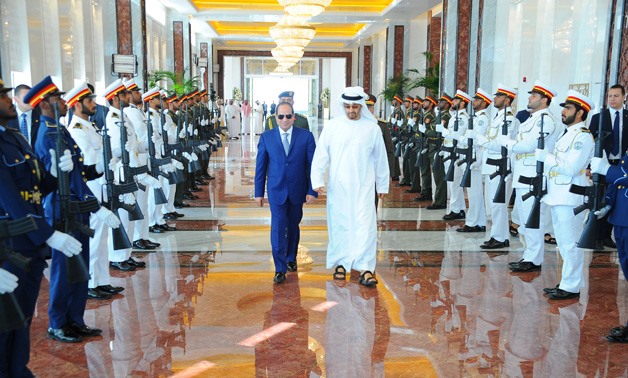 rown Prince of Abu Dhabi Mohammed bin Zayed Al Nahyan (R) receives President Abdel Fatah al-Sisi (L)