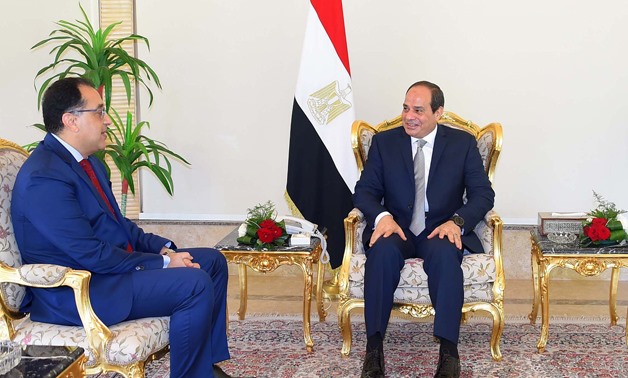 President Abdel Fatah al-Sisi talks with newly appointed Prime Minister Moustafa Madbouly on Thursday, June 7, 2018- press photot