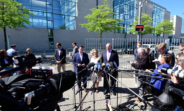  (L-R) German Labour Minister Hubertus Heil, German Environment Minister Svenja Schulze and German Economy Minister Peter Altmaier give a press statement on June 6, 2018 in front of the Chancellery in Berlin to comment on resolutions of the cabinet. / AFP