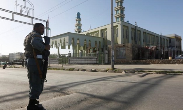 An Afghan policeman stands guard outside a mosque where a suicide bomber detonated a bomb, in Kabul, Afghanistan June 16, 2017. REUTERS/Omar Sobhani