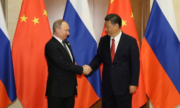 Russian President Vladimir Putin (R) and China's President Xi Jinping. | Photo: Reuters
