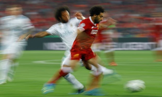 FILE PHOTO: Soccer Football - Champions League Final - Real Madrid v Liverpool - NSC Olympic Stadium, Kiev, Ukraine - May 26, 2018 Liverpool's Mohamed Salah in action with Real Madrid's Marcelo REUTERS/Kai Pfaffenbach
