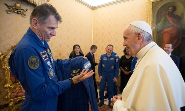Astronauts from the International Space Station gave Pope Francis his own blue jump suit on Friday - Reuters