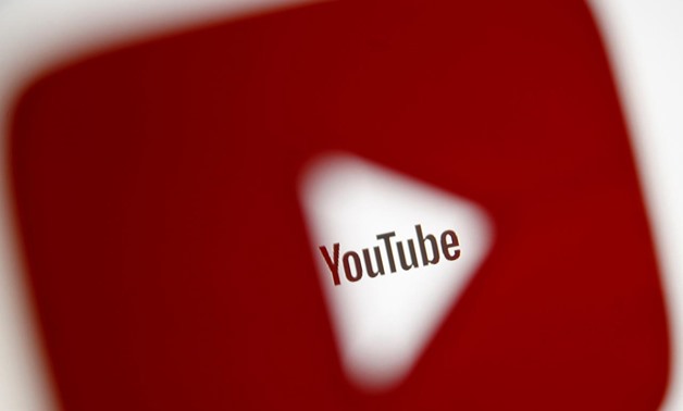 A 3D-printed YouTube icon is seen in front of a displayed YouTube logo in this illustration taken October 25, 2017. REUTERS