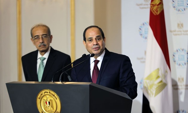 President Abdel Fatah al-Sisi (R) and former PM Sherif Ismail (L) during the Egyptian Family Iftar ceremony on June 12, 2018 – Press photo