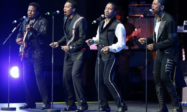(From L) Tito, Jackie, Marlon and Jermaine of Jackson 5 perform on stage during the Monte Carlo Summer Festival in Monaco, in 2014-AFP/File / VALERY HACHE

