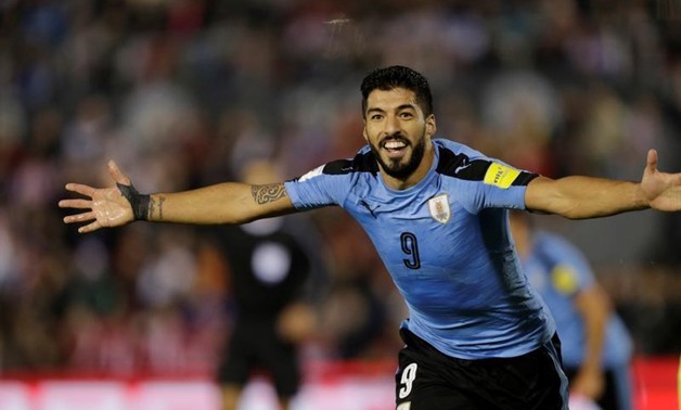 Uruguay's Luis Suarez celebrates after a goal against Paraguay. REUTERS/Mario Valdez
