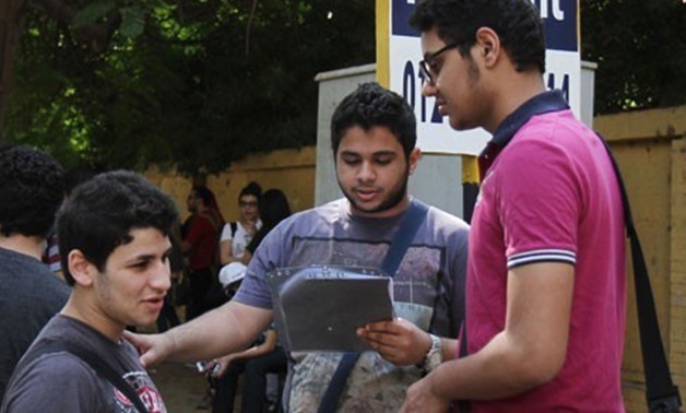 FILE - Group of Thanaweya Amma students revising before the exam in 2015