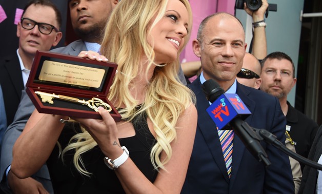 FILES- In this file photo taken on May 23, 2018 Adult film star Stormy Daniels receives a key to the city of West Hollywood in West Hollywood, California. 
