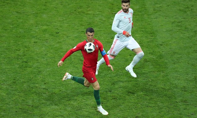 Soccer Football - World Cup - Group B - Portugal vs Spain - Fisht Stadium, Sochi, Russia - June 15, 2018 Portugal's Cristiano Ronaldo in action with Spain's Gerard Pique REUTERS/Lucy Nicholson
