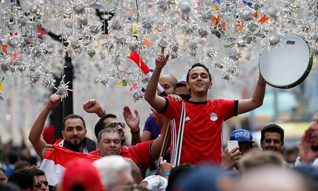 Supporters of the Egyptian national soccer team cheer during a gathering near Red Square on the eve of the 2018 FIFA World Cup in central Moscow, Russia June 13, 2018. REUTERS/Gleb Garanich