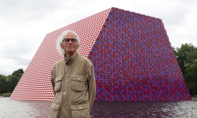 Artist Christo stands in front of his work The London Mastaba, on the Serpentine in Hyde Park, London, Britain, June 18, 2018. REUTERS/Simon Dawson