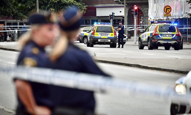 Police stand next to a cordon after a shooting on a street in central Malmo, Sweden June 18, 2018. TT News Agency/Johan Nilsson/via REUTERS
