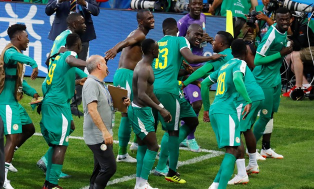 Soccer Football - World Cup - Group H - Poland vs Senegal - Spartak Stadium, Moscow, Russia - June 19, 2018 Senegal players celebrate after the match REUTERS/Kai Pfaffenbach