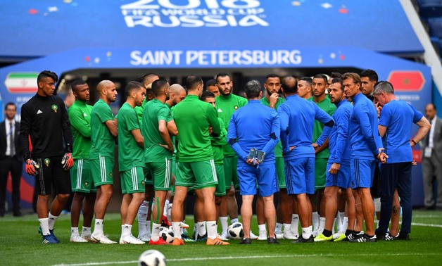 Soccer Football - World Cup - Morocco Training - Saint Petersburg Stadium, Saint Petersburg, Russia - June 14, 2018 Morocco coach Herve Renard and players during training REUTERS/Dylan Martinez 