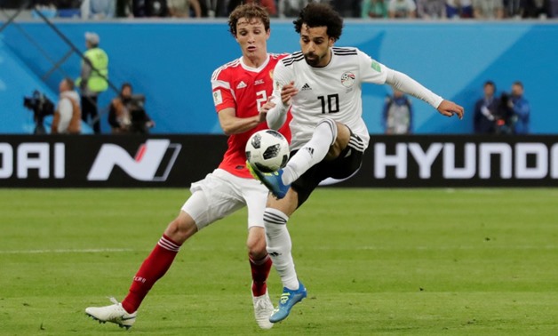 Russia - June 19, 2018 Egypt's Mohamed Salah in action with Russia's Mario Fernandes. REUTERS/Henry Romero 