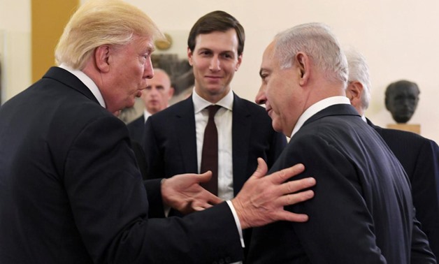 Israel's Prime Minister Benjamin Netanyahu and U.S. President Donald Trump chat as White House senior advisor Jared Kushner is seen in between them, during their meeting at the King David hotel in Jerusalem May 22, 2017. Kobi Gideon/Courtesy of Government