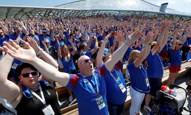 FILE PHOTO: Supporters of Iceland clap as they gather in Zaryadye Park Moscow, Russia - June 16, 2018. REUTERS/Sergei Karpukhin/File Photo

