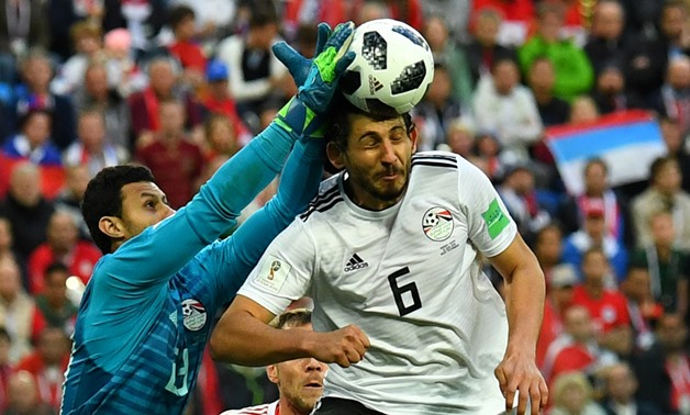 Soccer Football - World Cup - Group A - Russia vs Egypt - Saint Petersburg Stadium, Saint Petersburg, Russia - June 19, 2018 Egypt's Ahmed Hegazi and Mohamed El-Shenawy in action REUTERS/Dylan Martinez