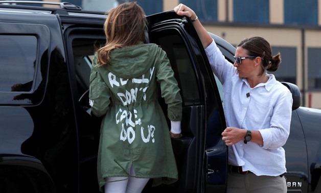 U.S. first lady Melania Trump walks from her to her motorcade wearing a Zara design jacket - AFP
