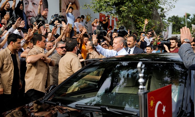 Turkish President Tayyip Erdogan waves to supporters as he leaves his residence in Istanbul, Turkey June 24, 2018. REUTERS/Alkis Konstantinidis